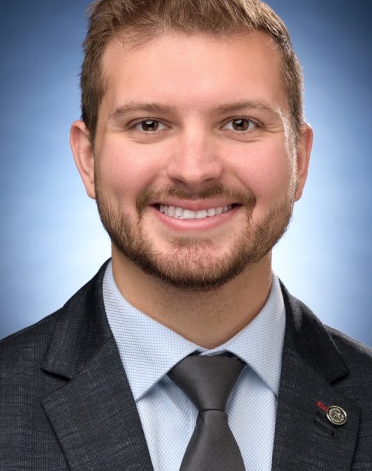 Ryan Lemmon sitting for a headshot