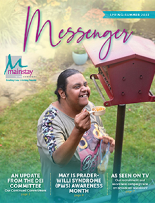 A female filling the bird feeder with bird food on the cover of the Spring - Summer 2022 Newsletter