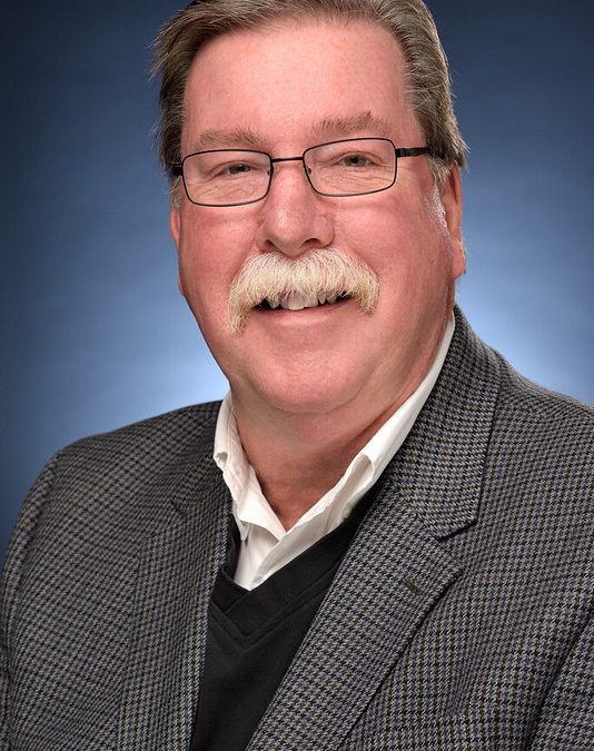 Reid Wolf, Chair of Mainstay, sitting for a headshot