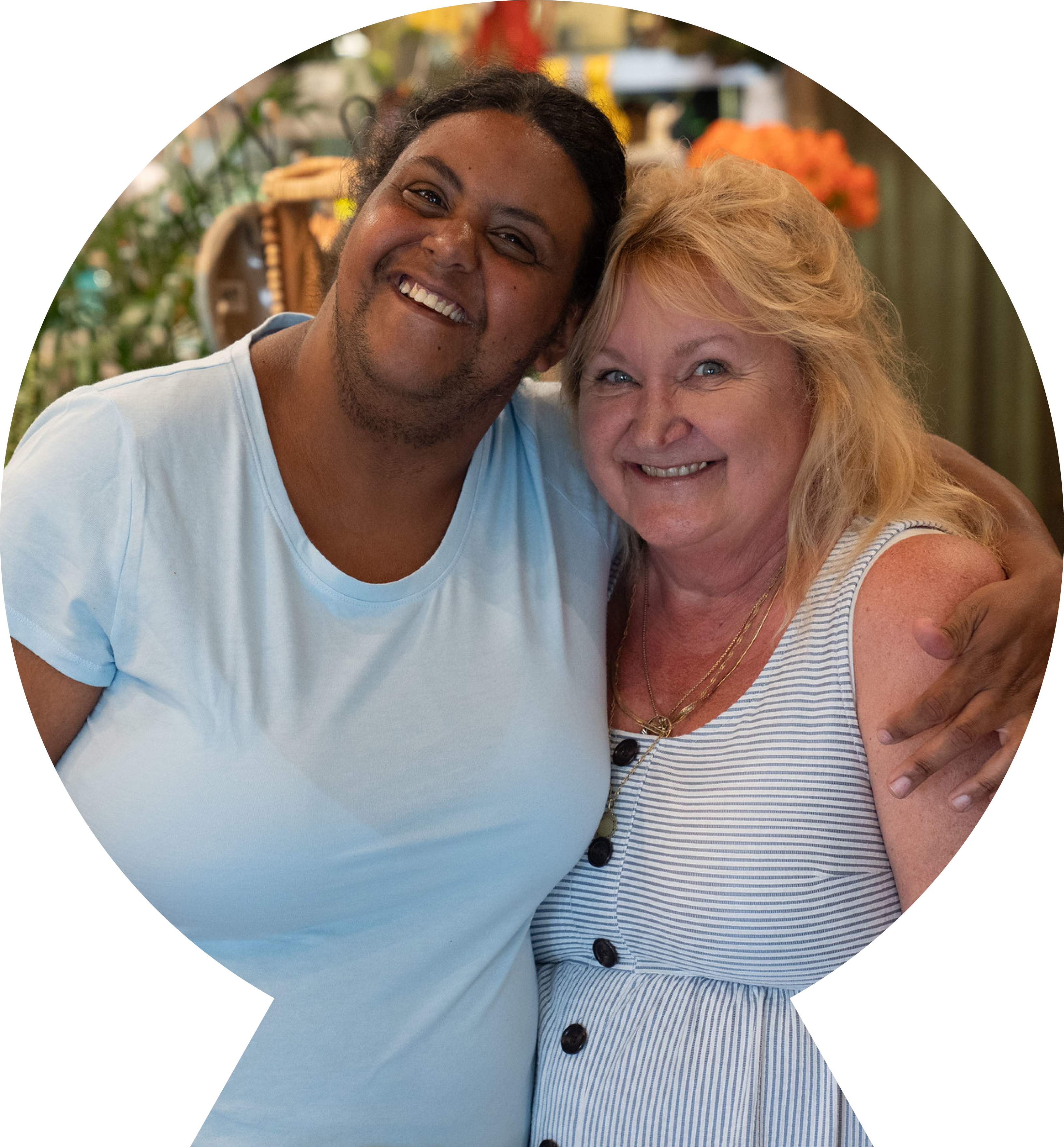 Female friends hugging and smiling for the camera